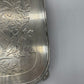 Exceptional footed silver tray with wooden serving handles and bird and floral engraving scene