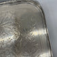 Exceptional footed silver tray with wooden serving handles and bird and floral engraving scene